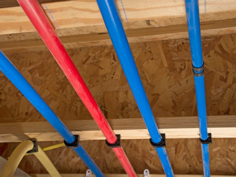 Certified expansion-type PEX-A hot and cold water lines run through floor joists